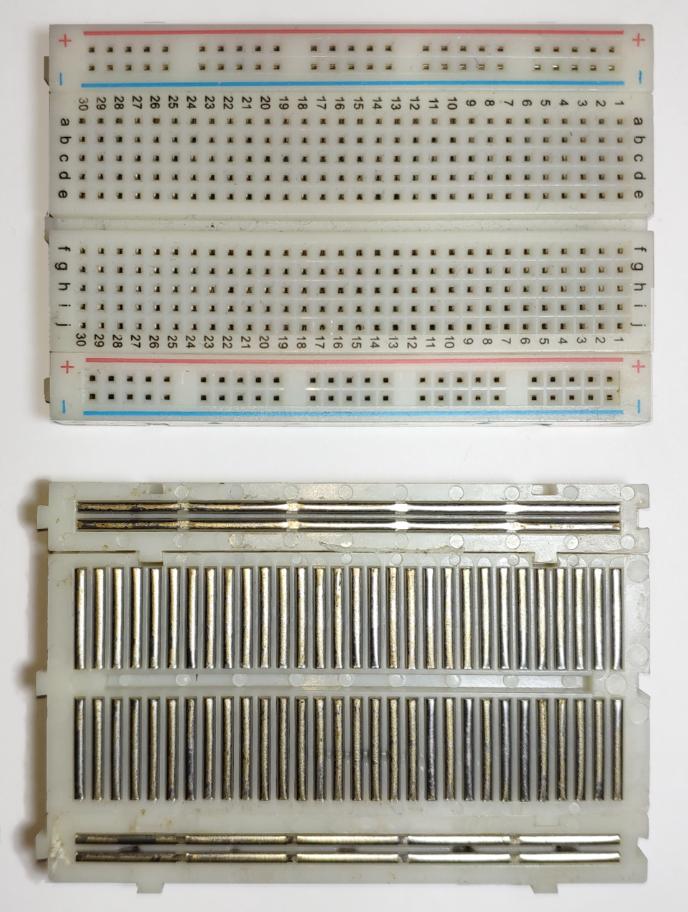 How a solderless breadboard looks on the underside